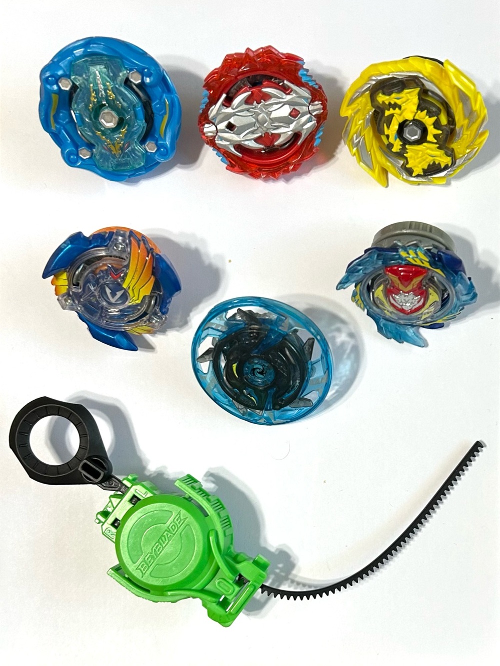 6 Beyblade Burst Evolution Switch Strike Beyblades & 1 Launcher /Ripcord. Tomy